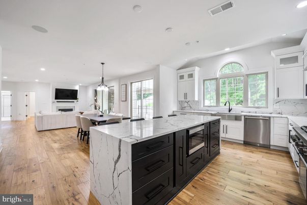 Dining room, Fireplace, Interior, Kitchen, Living room, Pendant Lights, Recessed Lighting, Stainless Steel Appliances, Wood Texture Flooring