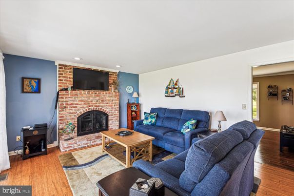Fireplace, Interior, Living room, Recessed Lighting, Stone Walls, Wood Texture Flooring