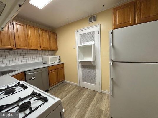 Interior, Kitchen, Tile Countertops, Wood Texture Flooring