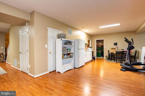 Dining room, Fitness Equipment, Interior, Kitchen, Recessed Lighting, Wood Texture Flooring