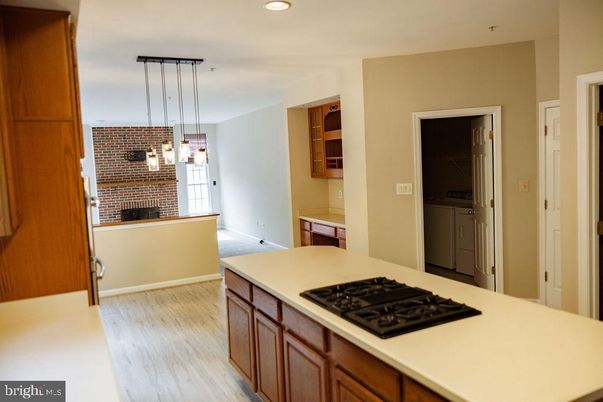 Fireplace, Interior, Kitchen, Pendant Lights, Recessed Lighting, Stone Walls, Wood Texture Flooring