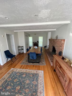 Dining room, Fireplace, Interior, Stone Walls, Wood Texture Flooring