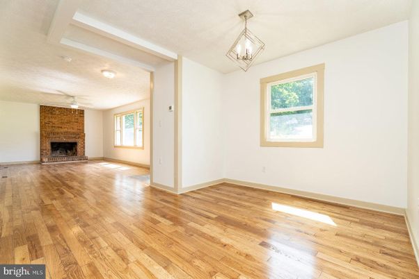 Empty room, Fireplace, Interior, Pendant Lights, Wood Texture Flooring