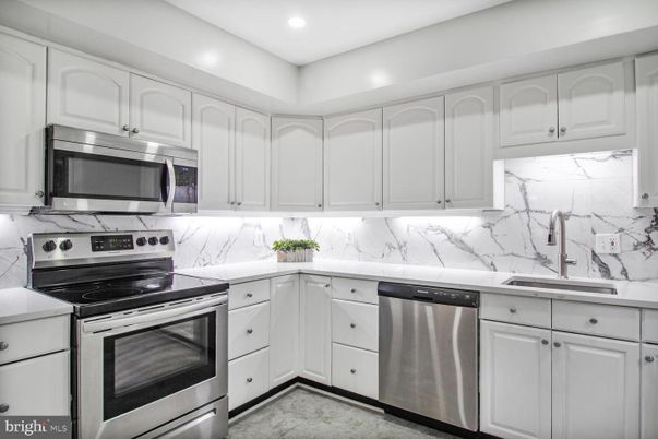 Interior, Kitchen, Marble Walls, Recessed Lighting, Stainless Steel Appliances