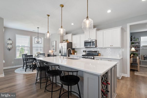 Dining room, Interior, Kitchen, Pendant Lights, Recessed Lighting, Stainless Steel Appliances, Wood Texture Flooring