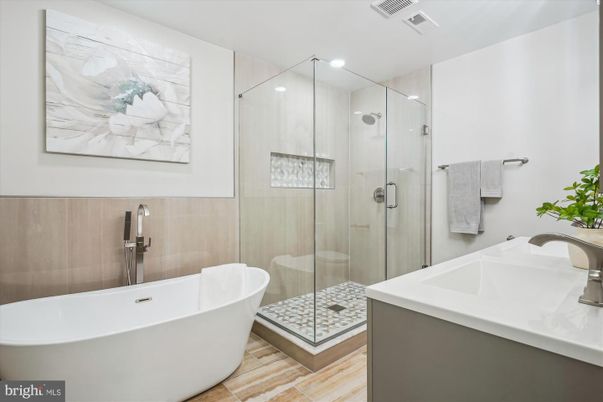 Bathroom, Free Standing Baths, Glass Shower, Interior, Recessed Lighting, Wood Texture Flooring
