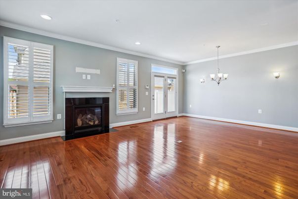 Chandelier, Empty room, Fireplace, Interior, Recessed Lighting, Wood Texture Flooring