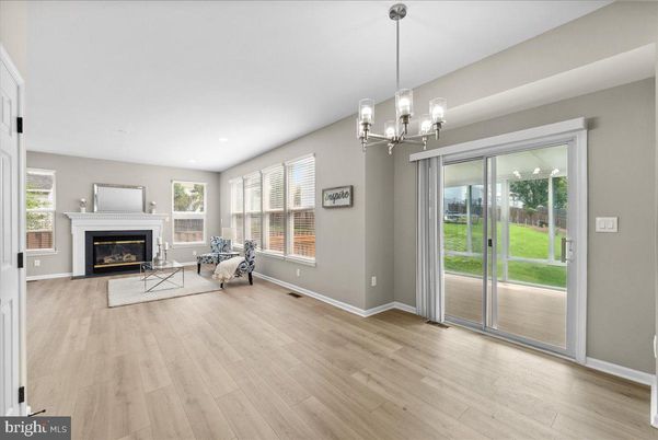 Empty room, Fireplace, Interior, Living room, Pendant Lights, Recessed Lighting, Wood Texture Flooring