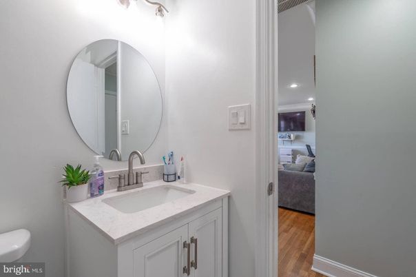 Bathroom, Dual Sink Vanities, Interior, Recessed Lighting, Wood Texture Flooring