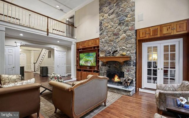 Fireplace, Interior, Living room, Recessed Lighting, Stone Walls, Wood Texture Flooring