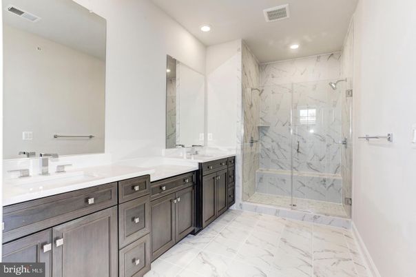 Bathroom, Dual Sink Vanities, Glass Shower, Interior, Marble, Marble Walls, Recessed Lighting