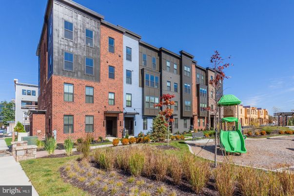 Exterior, Facade, Brick Facade, Playground, Condo Building