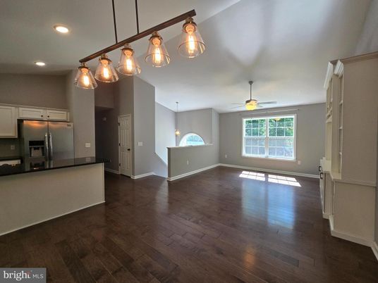 Empty room, Interior, Kitchen, Pendant Lights, Recessed Lighting, Stainless Steel Appliances, Wood Texture Flooring