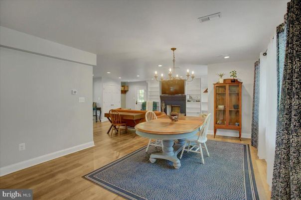 Chandelier, Dining room, Fireplace, Interior, Living room, Pendant Lights, Recessed Lighting, Wood Texture Flooring