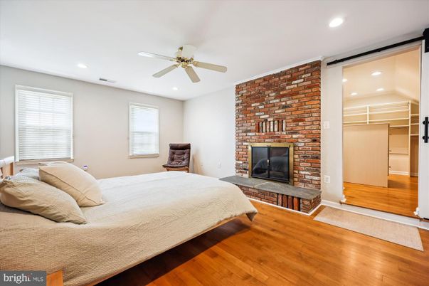 Bedroom, Fireplace, Interior, Recessed Lighting, Stone Walls, Wood Texture Flooring