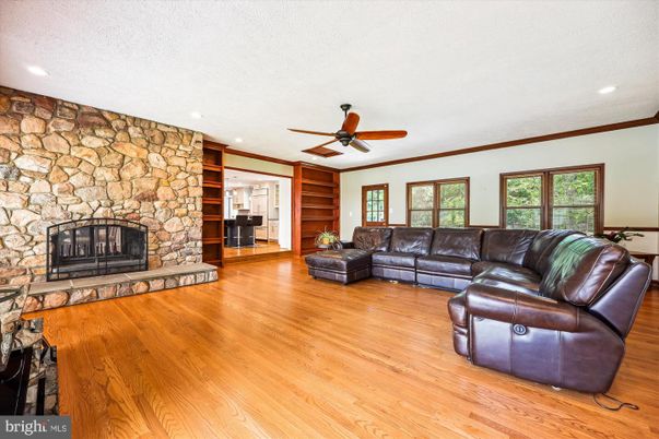 Fireplace, Interior, Living room, Recessed Lighting, Stone Walls, Wood Texture Flooring