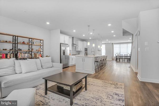 Dining room, Interior, Kitchen, Living room, Pendant Lights, Recessed Lighting, Stainless Steel Appliances, Wood Texture Flooring