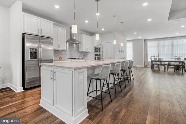 Dining room, Interior, Kitchen, Pendant Lights, Recessed Lighting, Stainless Steel Appliances, Wood Texture Flooring