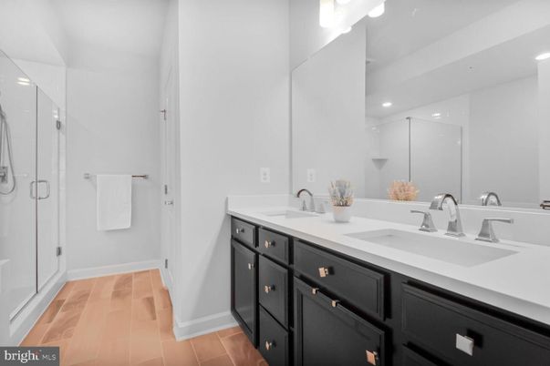 Bathroom, Dual Sink Vanities, Glass Shower, Interior, Recessed Lighting, Wood Texture Flooring