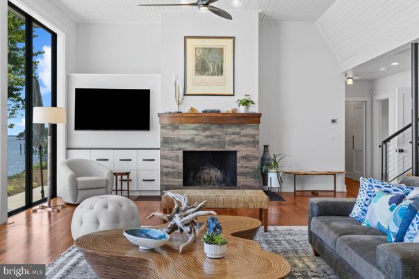 Fireplace, Interior, Living room, Recessed Lighting, Water, Wood Texture Flooring