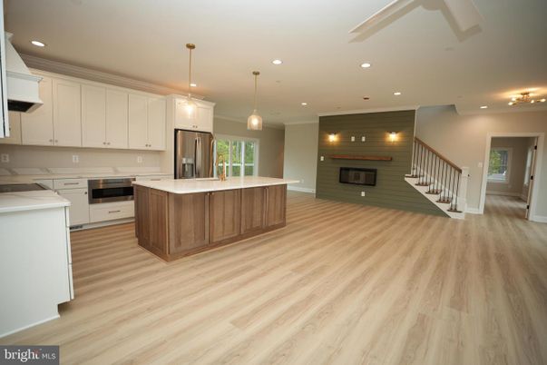 Fireplace, Interior, Kitchen, Pendant Lights, Recessed Lighting, Stainless Steel Appliances, Wood Texture Flooring