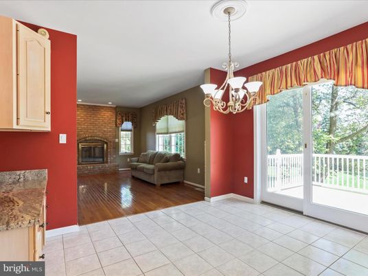Chandelier, Fireplace, Interior, Recessed Lighting, Stone Walls, Wood Texture Flooring