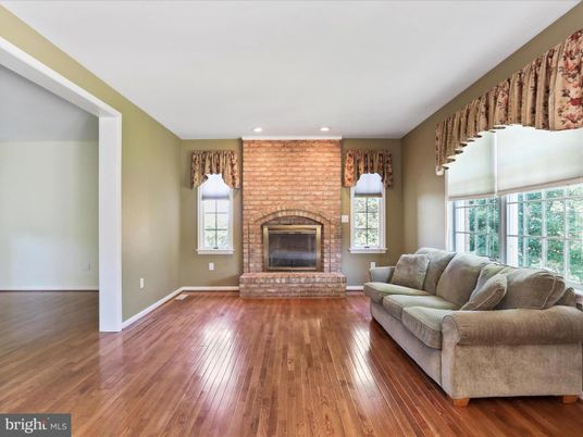 Fireplace, Interior, Living room, Recessed Lighting, Stone Walls, Wood Texture Flooring