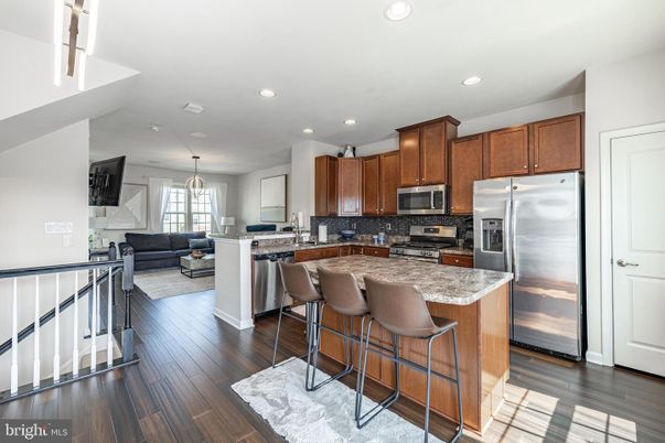 Chandelier, Interior, Kitchen, Living room, Pendant Lights, Recessed Lighting, Stainless Steel Appliances, Wood Texture Flooring