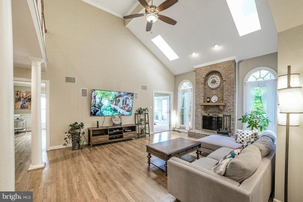 Fireplace, Interior, Living room, Recessed Lighting, Stone Walls, Wood Texture Flooring