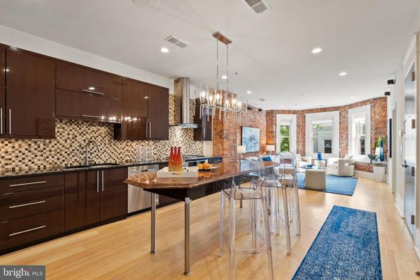 Dining room, Interior, Kitchen, Living room, Pendant Lights, Recessed Lighting, Stainless Steel Appliances, Stone Walls, Wood Texture Flooring