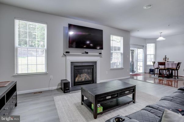Dining room, Fireplace, Interior, Living room, Pendant Lights, Recessed Lighting, Wood Texture Flooring