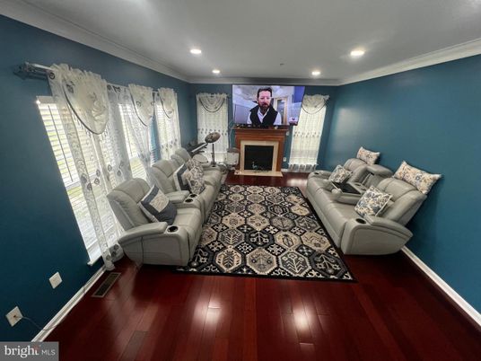 Fireplace, Interior, Living room, Recessed Lighting, Theatre Room, Wood Texture Flooring