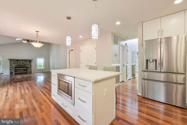 Fireplace, Interior, Kitchen, Pendant Lights, Recessed Lighting, Stainless Steel Appliances, Wood Texture Flooring