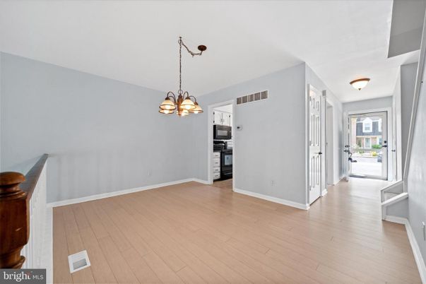 Chandelier, Empty room, Interior, Kitchen, Pendant Lights, Stainless Steel Appliances, Wood Texture Flooring