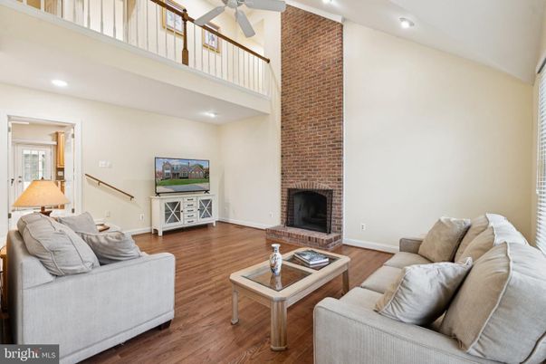 Fireplace, Interior, Living room, Recessed Lighting, Stone Walls, Wood Texture Flooring