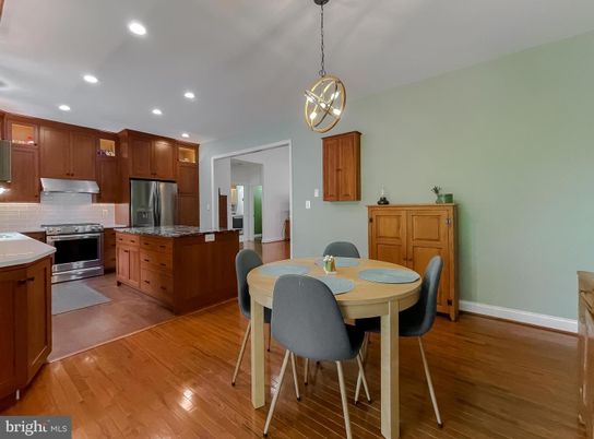 Dining room, Interior, Kitchen, Pendant Lights, Recessed Lighting, Stainless Steel Appliances, Wood Texture Flooring