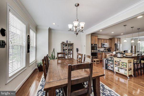 Chandelier, Dining room, Interior, Kitchen, Pendant Lights, Recessed Lighting, Stainless Steel Appliances, Wood Texture Flooring