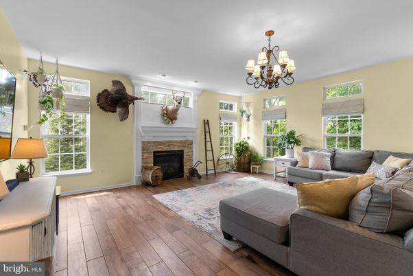 Chandelier, Fireplace, Interior, Living room, Recessed Lighting, Wood Texture Flooring