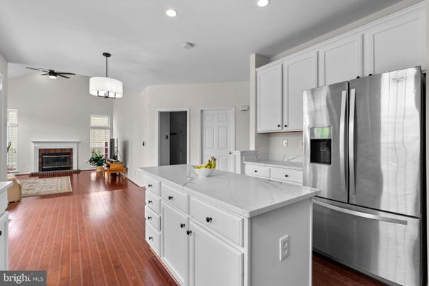 Fireplace, Interior, Kitchen, Pendant Lights, Recessed Lighting, Stainless Steel Appliances, Wood Texture Flooring