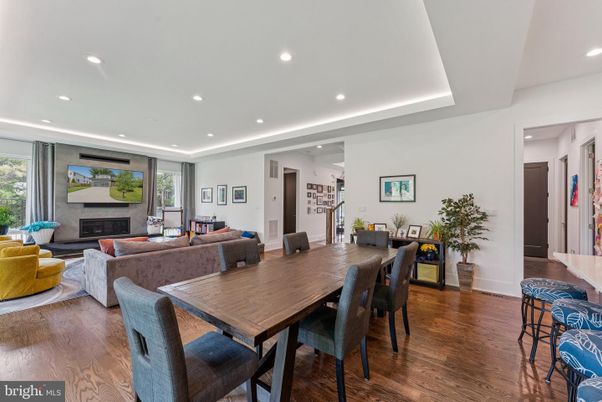 Dining room, Fireplace, Interior, Living room, Recessed Lighting, Wood Texture Flooring