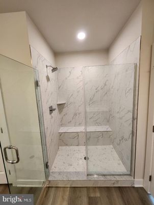 Bathroom, Glass Shower, Interior, Marble Walls, Recessed Lighting, Wood Texture Flooring