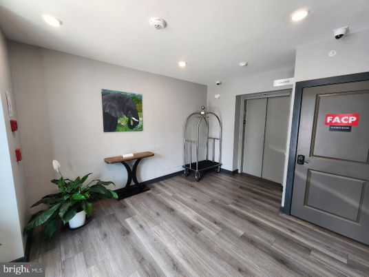 Elevator, Interior, Recessed Lighting, Wood Texture Flooring