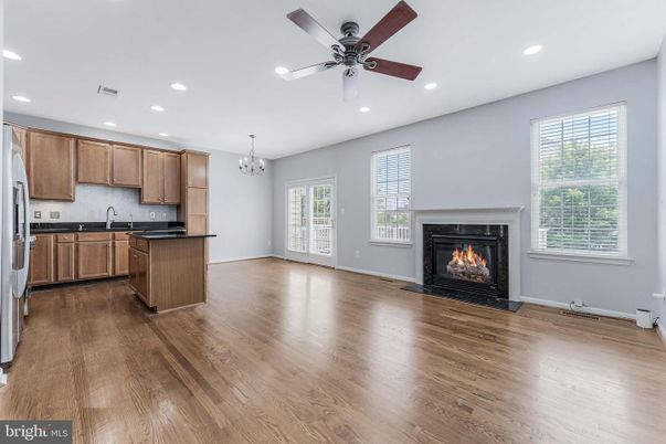 Chandelier, Empty room, Fireplace, Interior, Kitchen, Recessed Lighting, Wood Texture Flooring