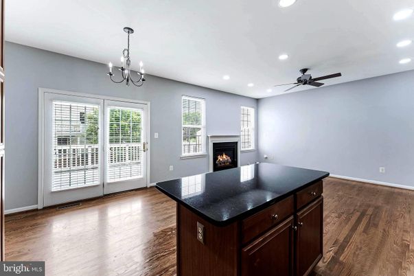 Chandelier, Empty room, Fireplace, Interior, Recessed Lighting, Wood Texture Flooring