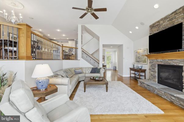 Fireplace, Interior, Living room, Recessed Lighting, Stone Walls, Wood Texture Flooring
