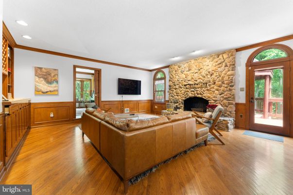 Fireplace, Interior, Living room, Recessed Lighting, Stone Walls, Wood Texture Flooring