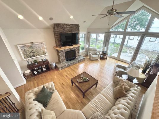 Fireplace, Interior, Living room, Recessed Lighting, Stone Walls, Wood Texture Flooring