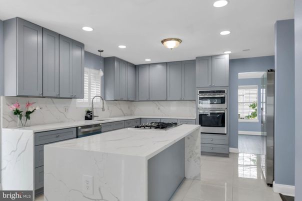 Interior, Kitchen, Marble Walls, Recessed Lighting, Stainless Steel Appliances
