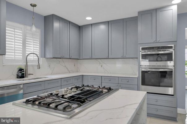 Interior, Kitchen, Marble Walls, Pendant Lights, Recessed Lighting, Stainless Steel Appliances