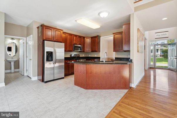 Interior, Kitchen, Recessed Lighting, Stainless Steel Appliances, Washer, Wood Texture Flooring
